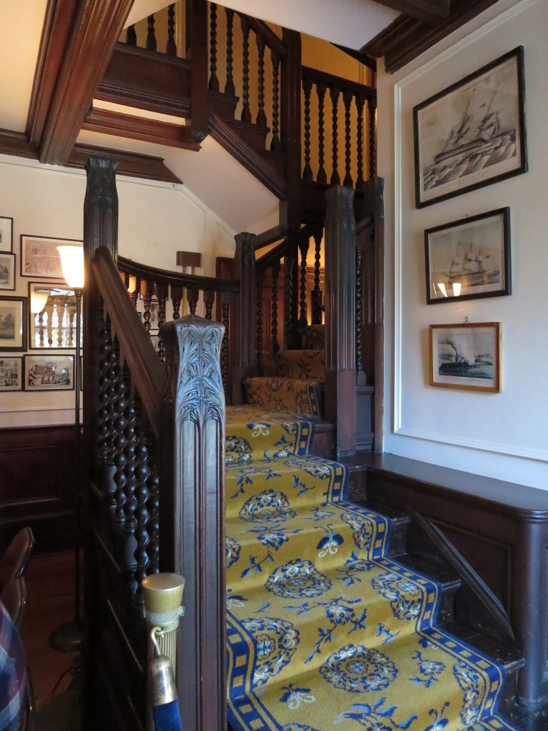 The main staircase featured such a beautiful banister; the woodwork throughout the home, while on the heavy/dark side, really lent an air of richness.